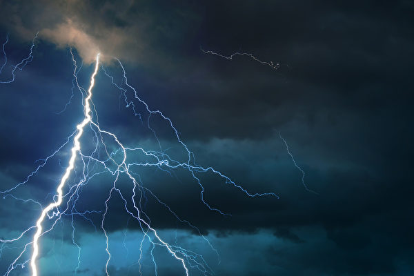 Fork lightning striking down during summer storm