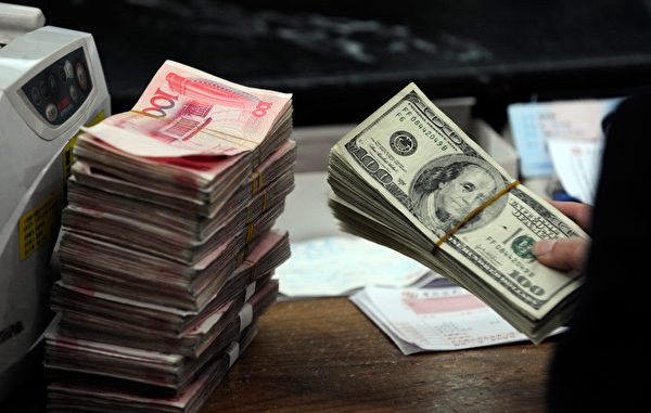 A Chinese bank worker prepares to count