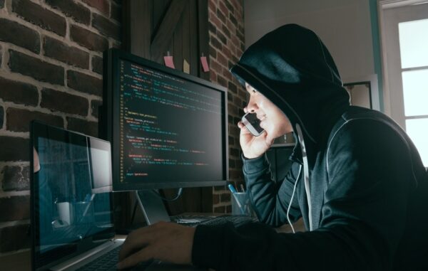 Hacker,Using,Mobile,Smartphone,Calling,For,Victim,And,Stealing,Personal